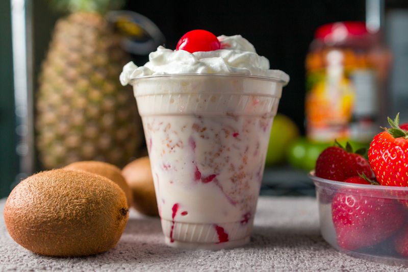 Thick strawberry milkshake with whipped cream